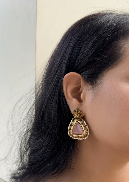 Earring worn by a person with a neutral background