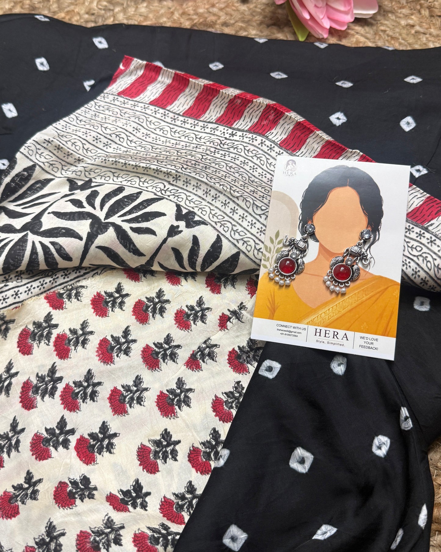Fabric with floral patterns and a card with earrings displayed on top