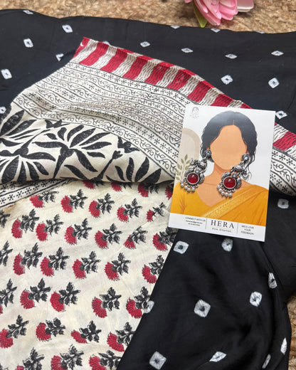Fabric with floral patterns and a card with earrings displayed on top