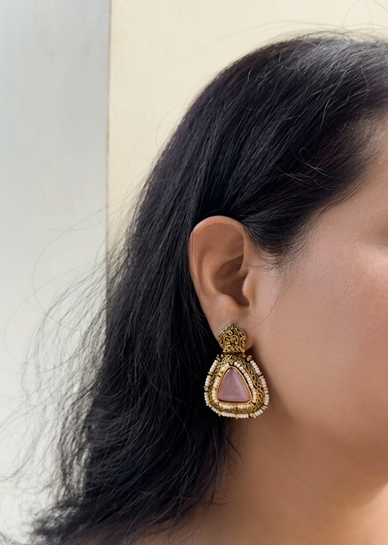 Earring worn by a person with a neutral background